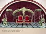 جایگاه کریستالی طاووسی آماده اجاره برای مراسم عروسی و اجرای شیک و لوکس مناسب برای مراسم عروسی به همراه گل‌ارایی و شمع ارایی دیزاین جایگاه عروس و داماد